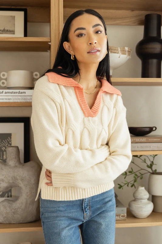 cream sweater with coral collar