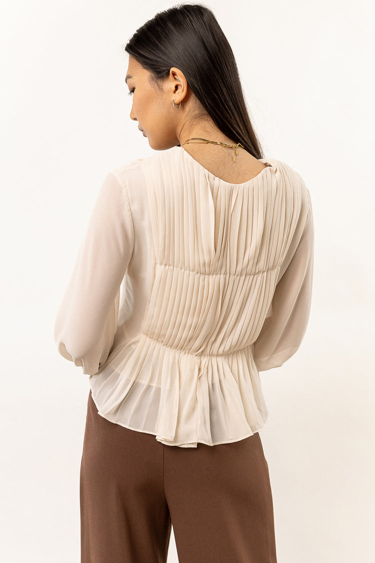 sheer cream top with long sleeves