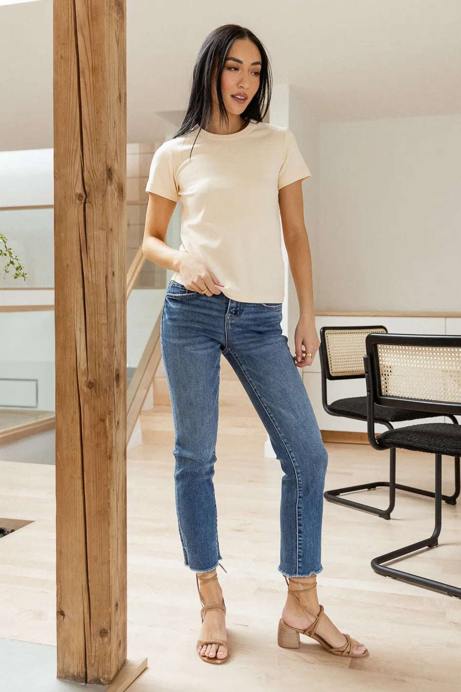 cream short sleeve tee shirt paired with straight leg denim