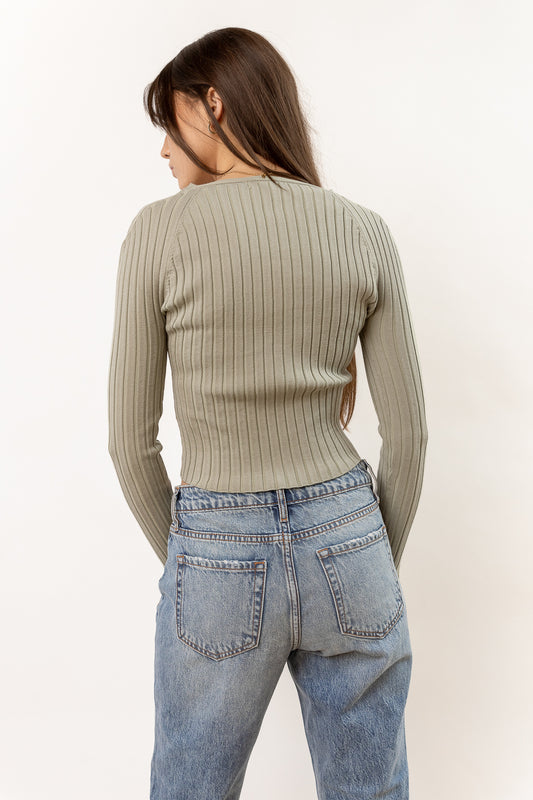 long sleeve ribbed sage shirt paired with denim