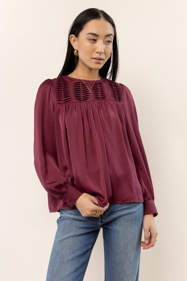burgundy blouse with smocked detail