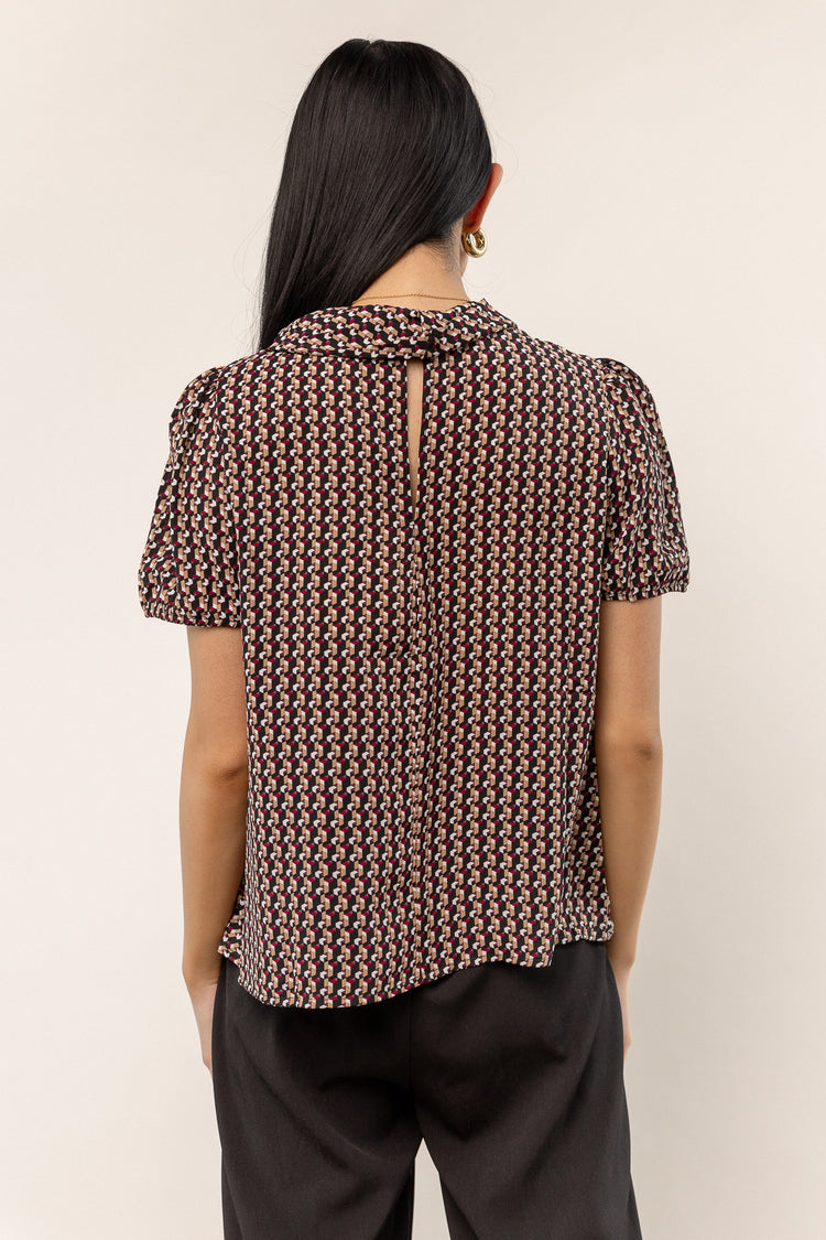 black short sleeve blouse with print