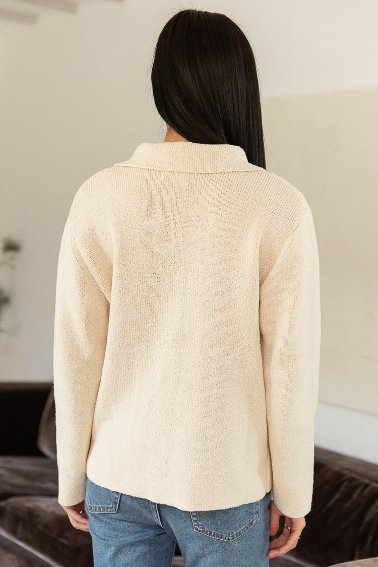 backside of knitted oatmeal cardigan 