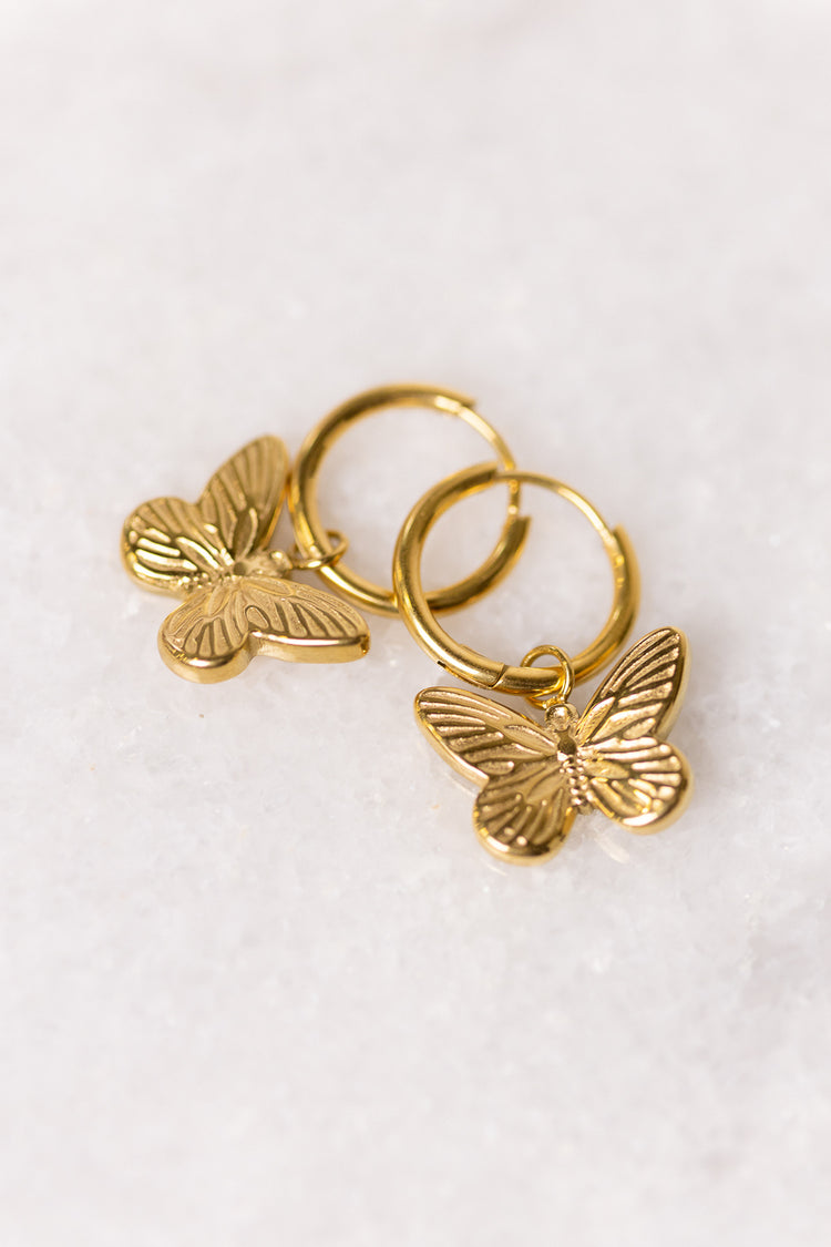hoop earrings with butterfly dangle charm