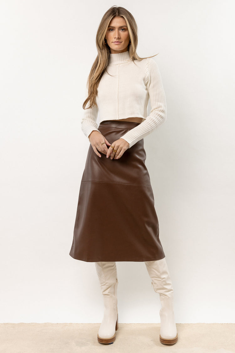 model wearing brown midi skirt