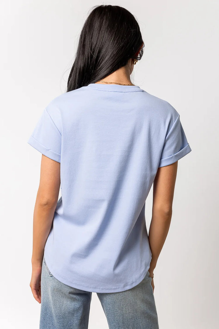 blue short sleeve top with rolled sleeve detail