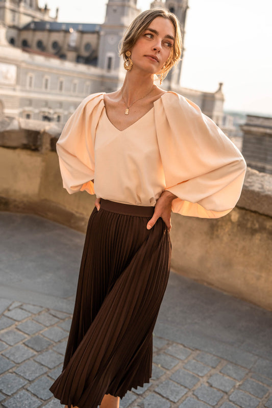 beige blouse with puffy sleeves
