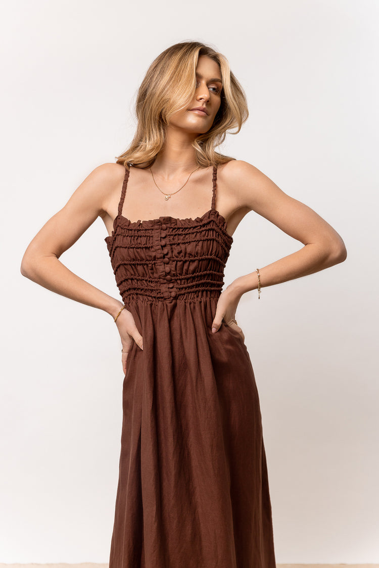 brown dress with small straps and front buttons