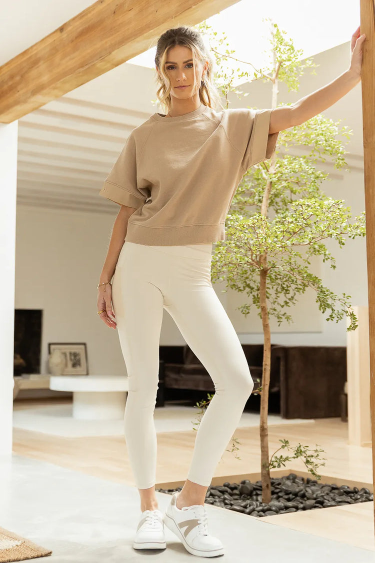 taupe short sleeve paired with cream leggings