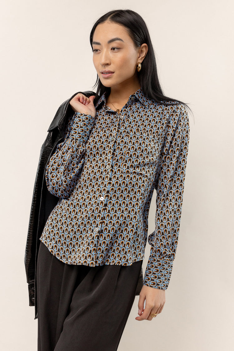 model wearing long sleeved printed button up 