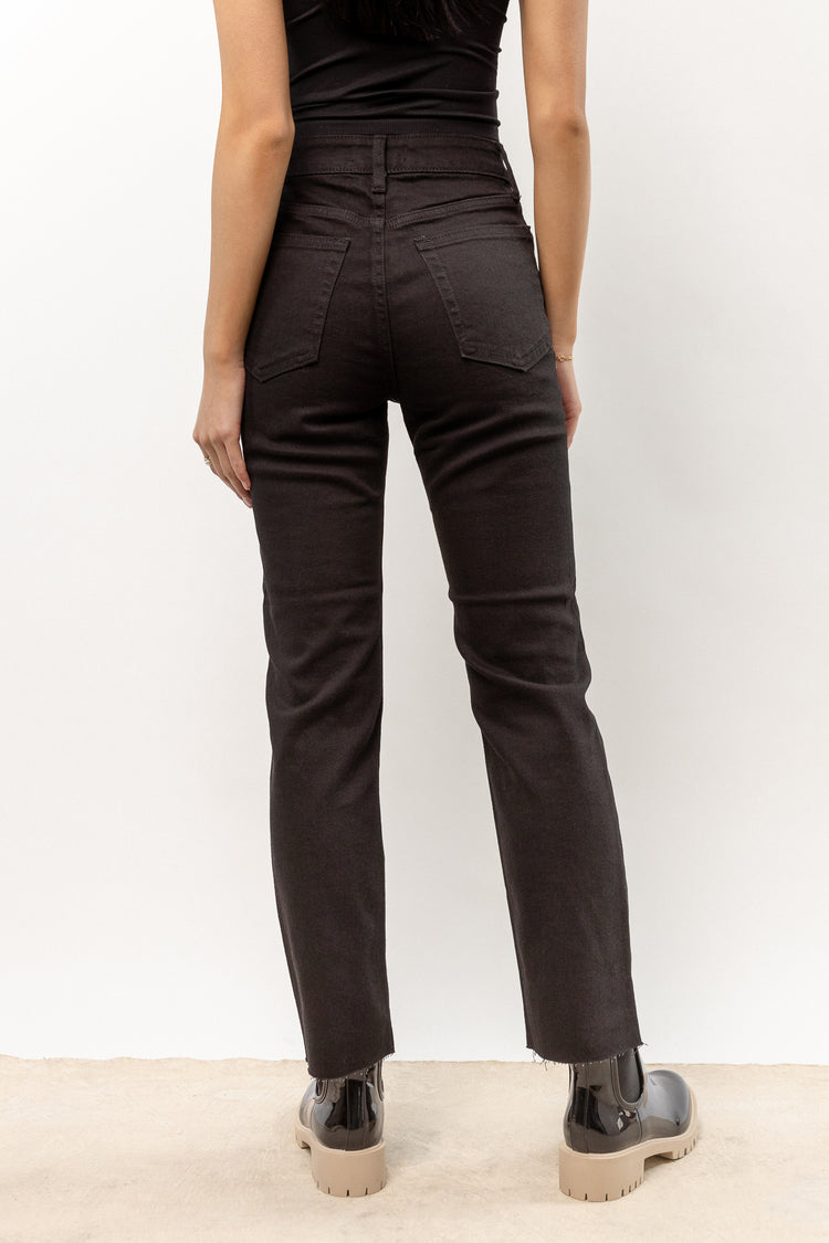 solid black jeans with raw hem