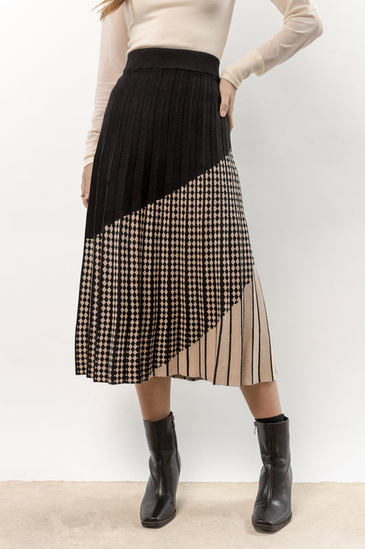 model is wearing printed maxi skirt with square toe boots