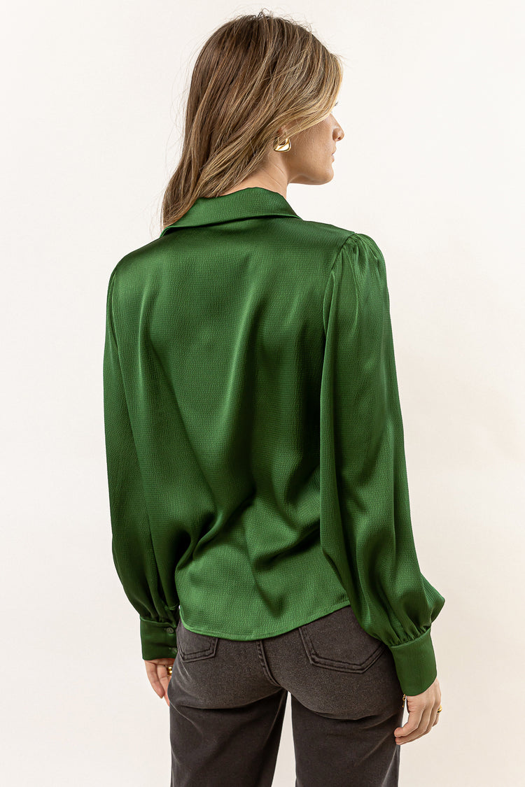 green satin blouse with long sleeves