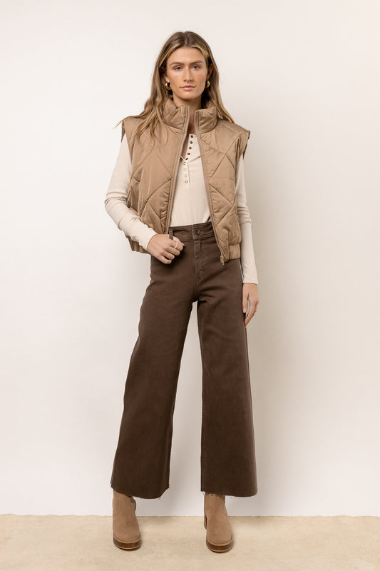 Pants in brown paired with a vest 
