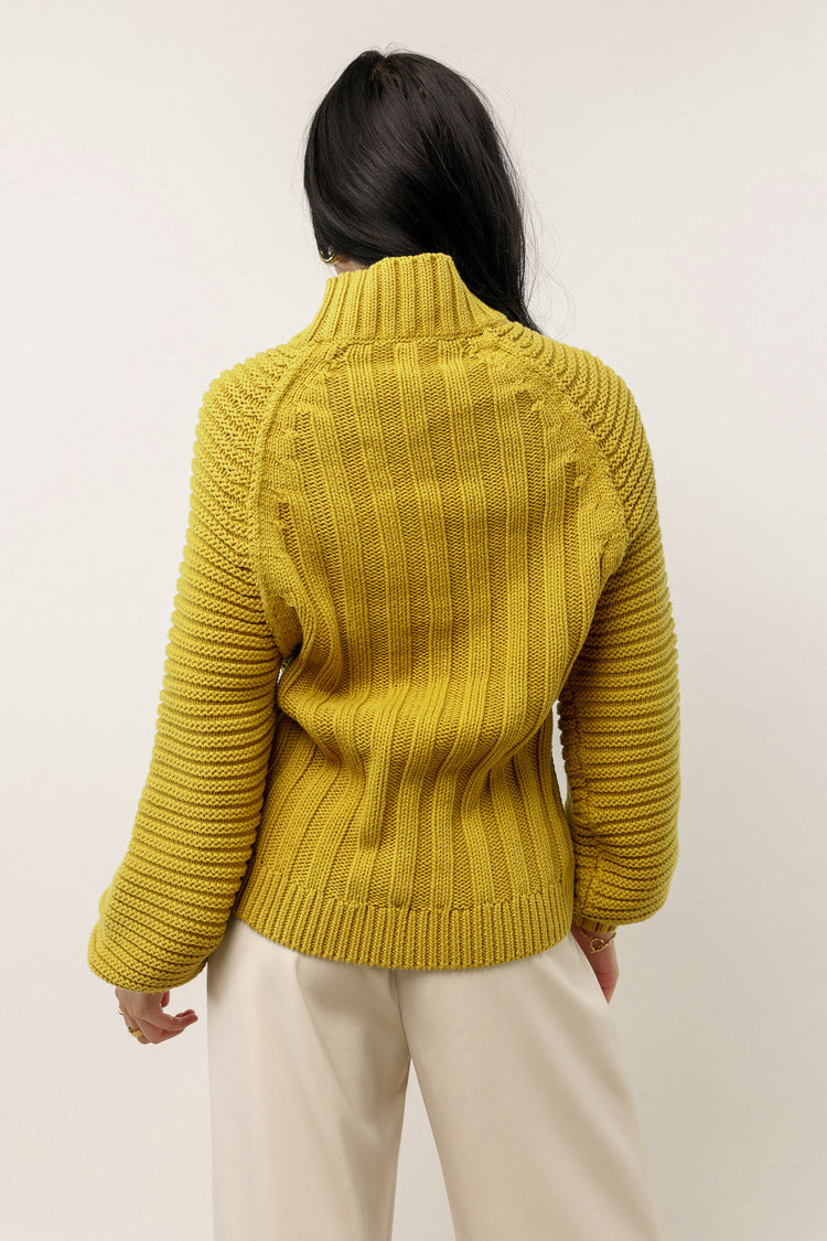 yellow sweater with high neck