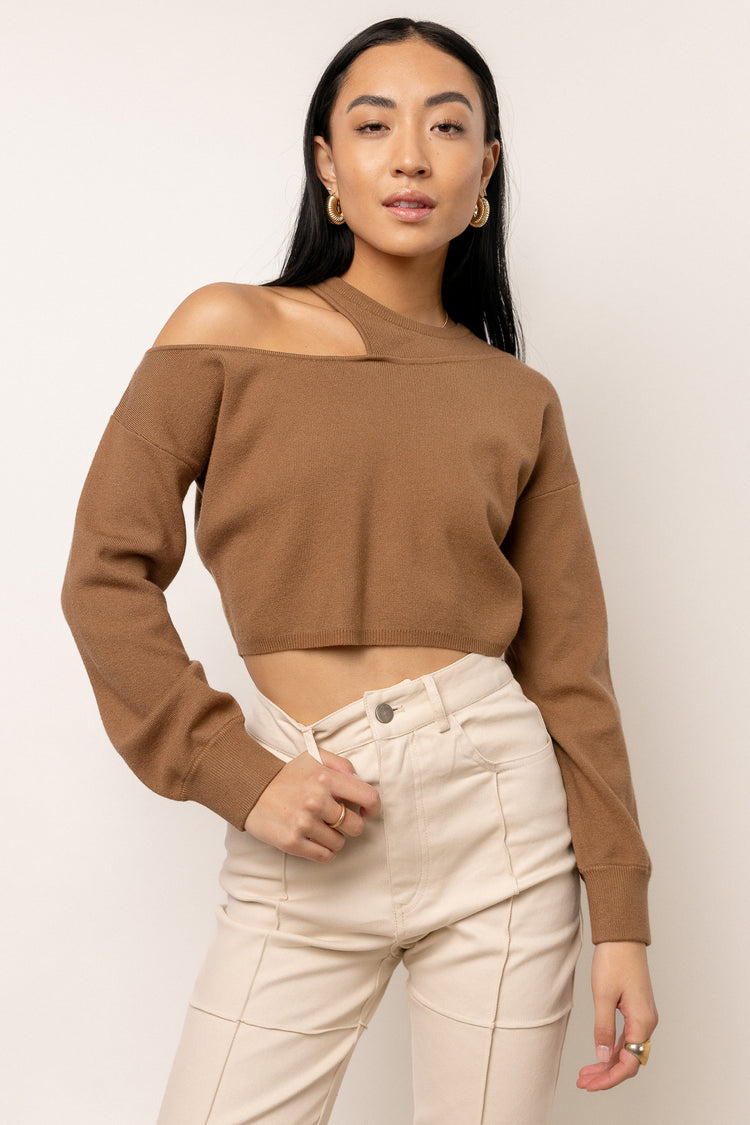 model is wearing cropped sweater top