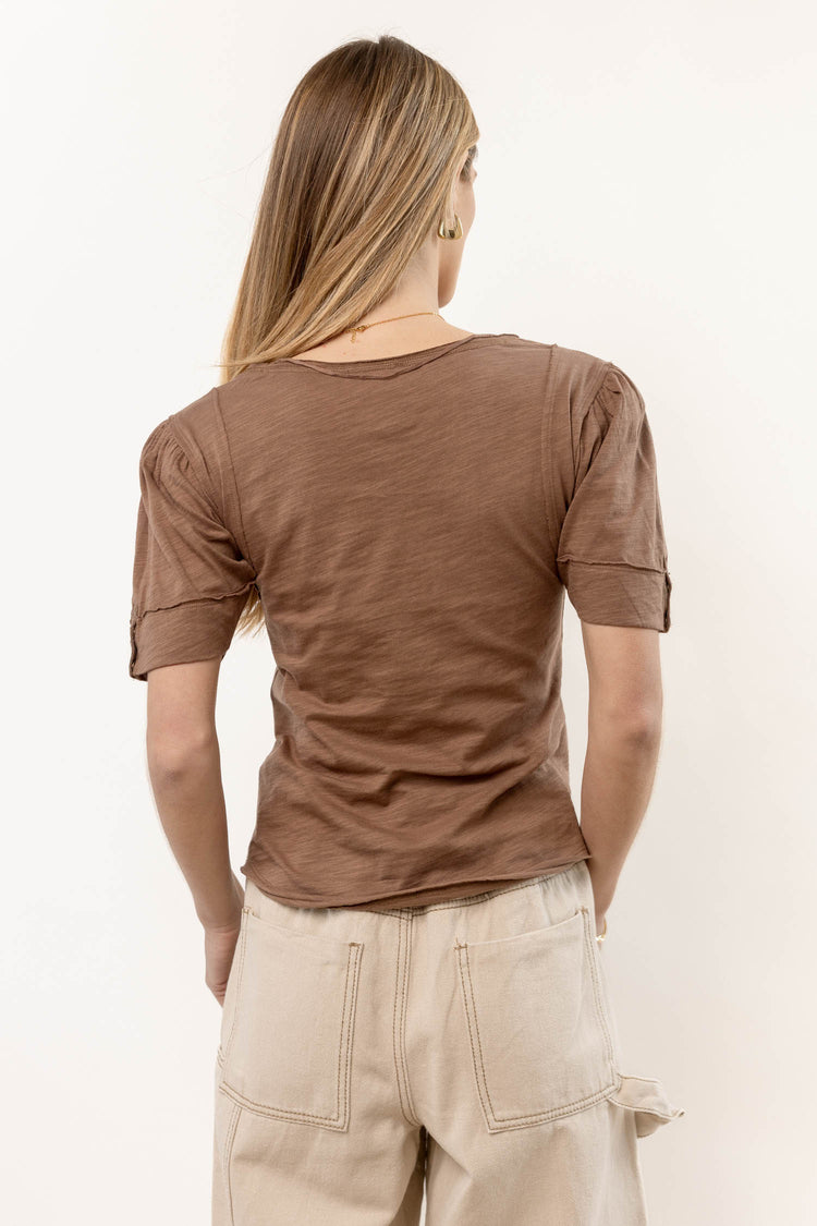 brown top with raw hem detail