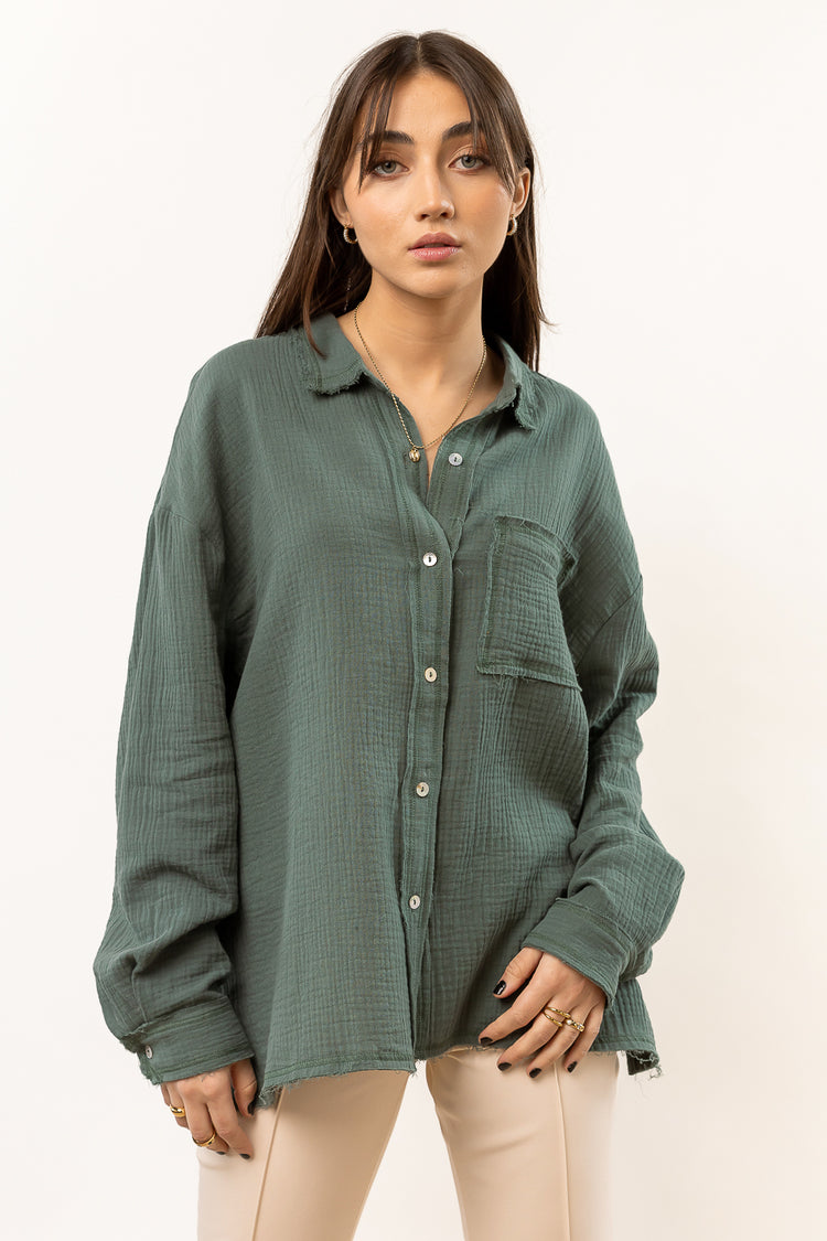 teal button up with long sleeves