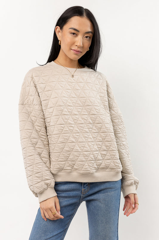 model is wearing quilted pullover