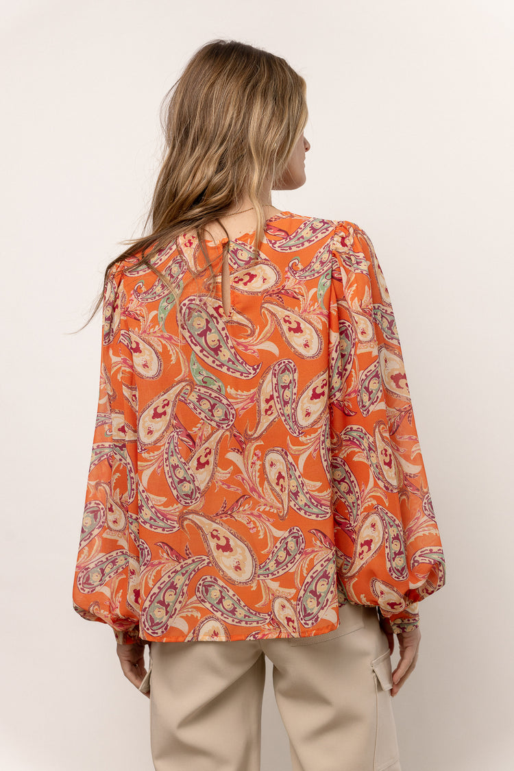 orange blouse with puffy sleeves