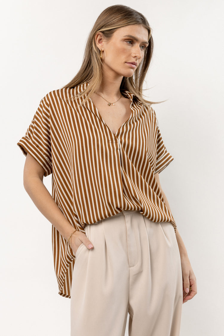 model is wearing stripe top with ivory bottoms