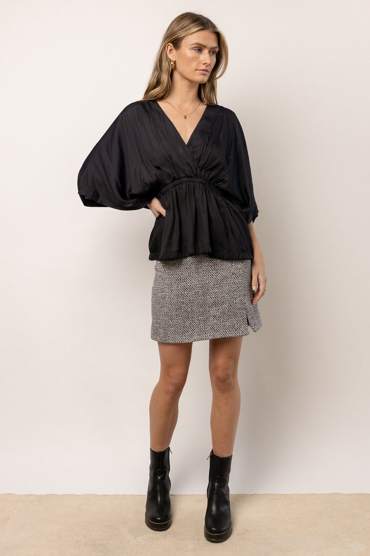 black blouse with butterfly sleeves
