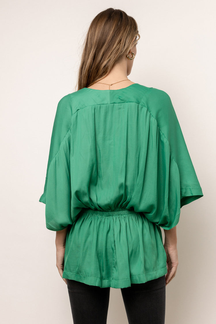 green blouse with butterfly sleeves