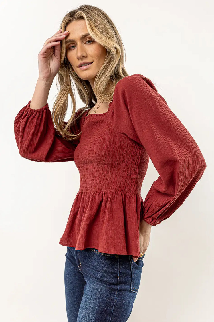 rust blouse with ruffle detail