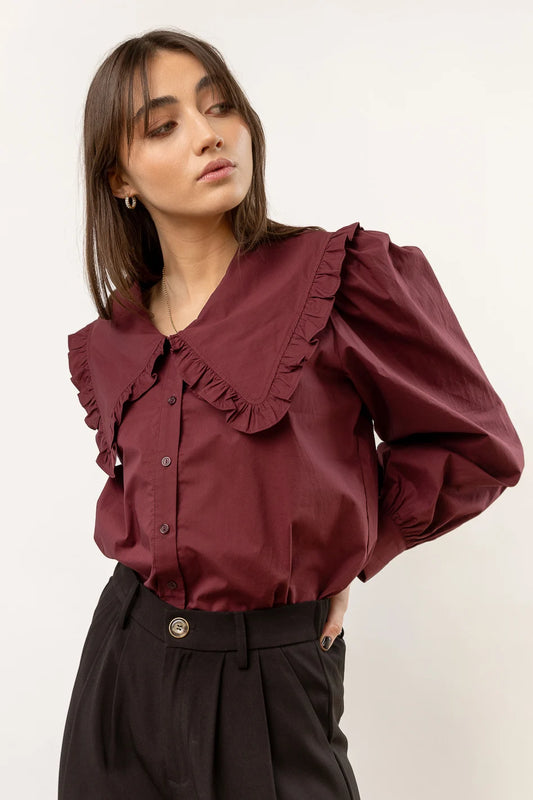 burgundy blouse with long sleeves